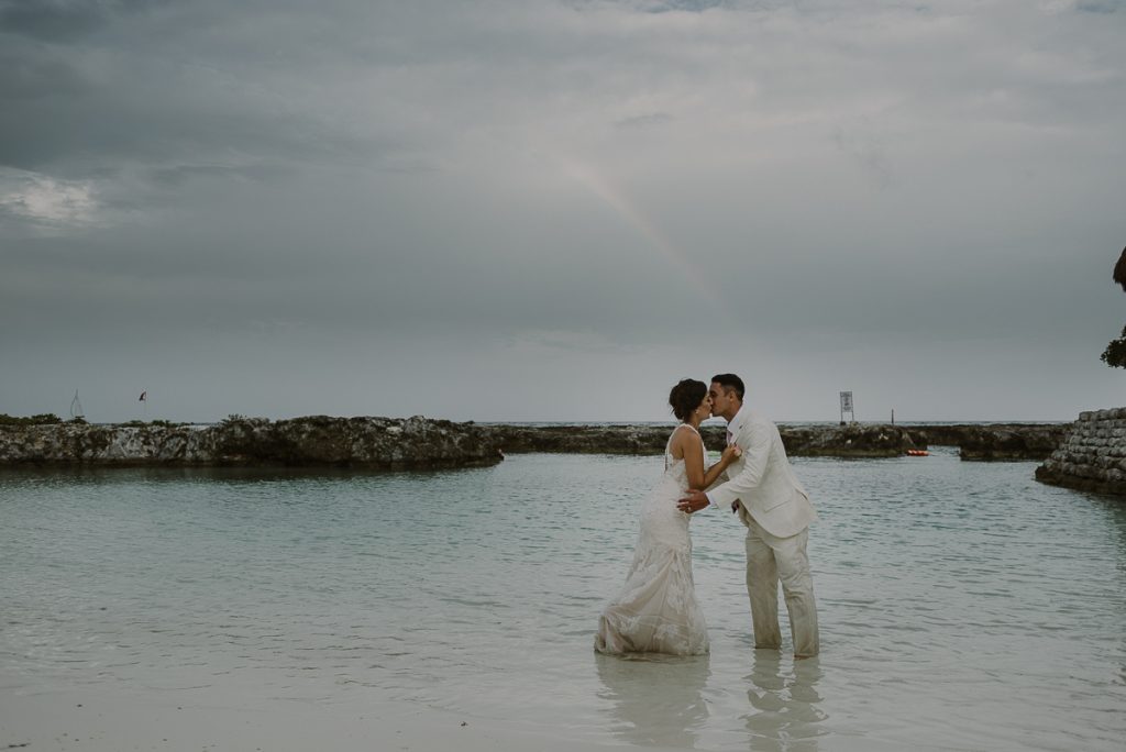 Hard Rock Riviera Maya beach trash the Dress Session with rainbow in Mexico by Caro Navarro Photography