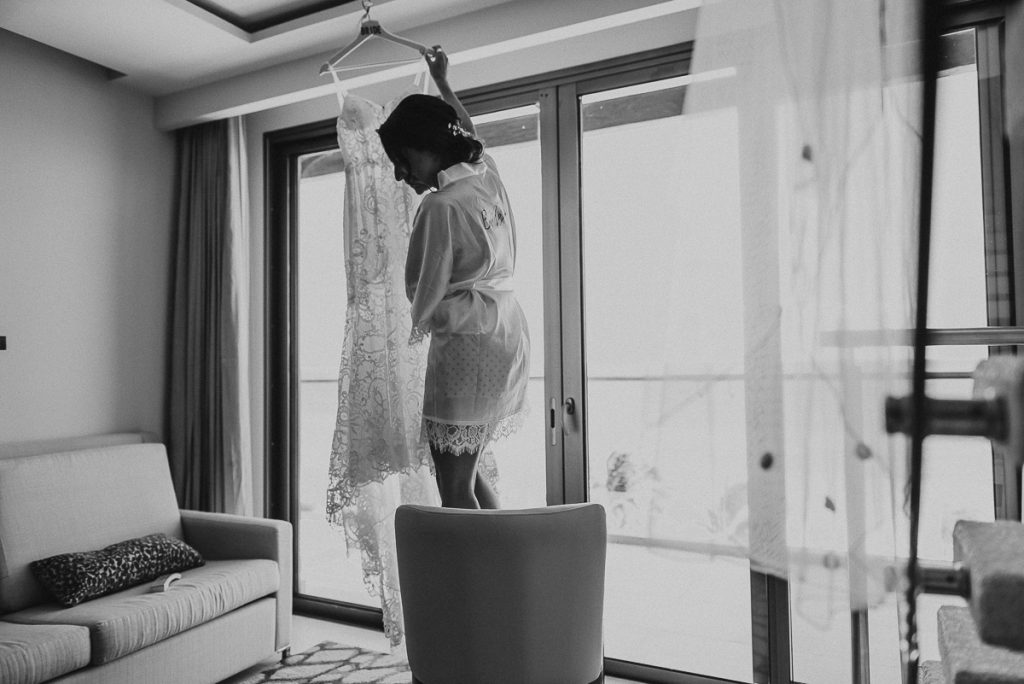 Black and white photo of bride and wedding dress. Royalton Riviera Cancun Wedding by Caro Navarro Photography