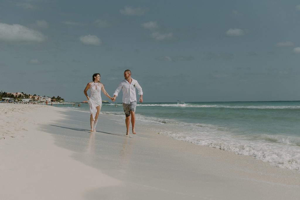 Bride and groom beach portraits at Royal Hideaway Playacar in Mexico by Caro Navarro Photography