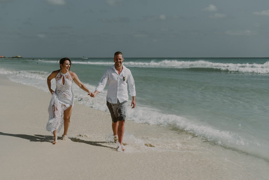 Bride and groom beach portraits at Royal Hideaway Playacar in Mexico by Caro Navarro Photography
