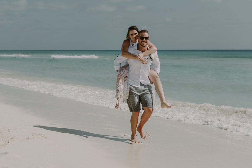 Bride and groom beach portraits at Royal Hideaway Playacar in Mexico by Caro Navarro Wedding Photography