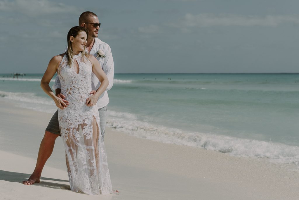 Bride and groom beach portraits at Royal Hideaway Playacar in Mexico by Caro Navarro Wedding Photography