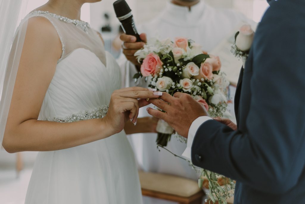 Ring exchange at Religious Hard Rock Riviera Maya Destination Wedding. Caro Navarro Photography