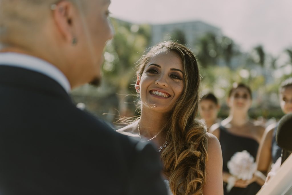 Bride smiling during Riu Caribe Cancun beach wedding by Caro Navarro Photography