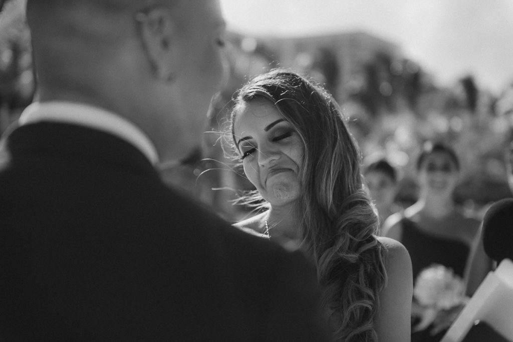 Black and white photo of bride at Riu Caribe Cancun beach wedding by Caro Navarro Photography