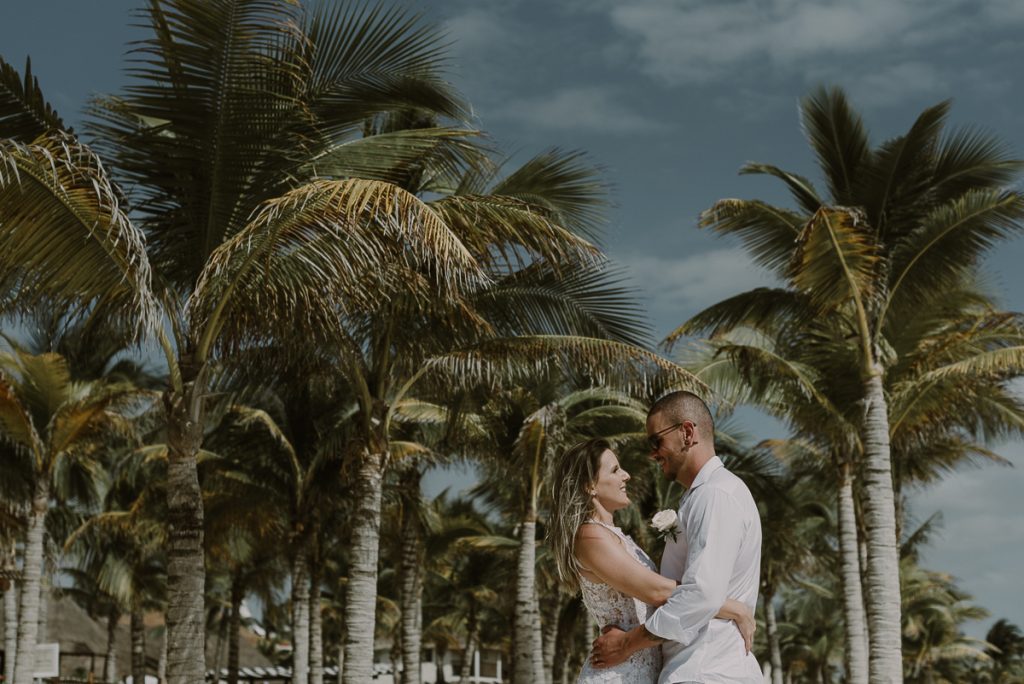 Bride and groom beach portraits at Royal Hideaway Playacar in Mexico by Caro Navarro Wedding Photography