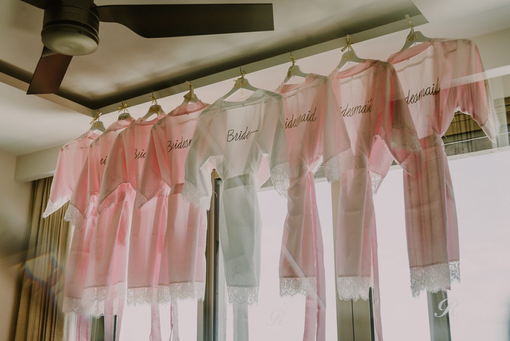 White and pink silk robes for bridal party. Royalton Riviera Cancun Wedding by Caro Navarro Photography