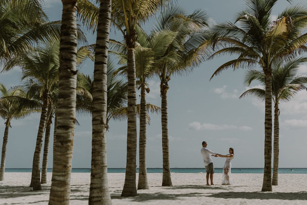 Bride and groom beach portraits at Royal Hideaway Playacar in Mexico by Caro Navarro Wedding Photography