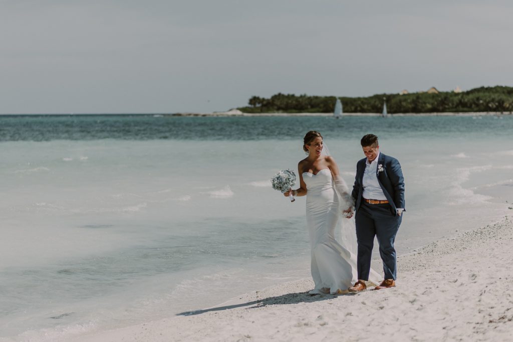Bride and bride beach portraits at Grand Palladium Riviera Maya LGBT Wedding in Mexico. Caro Navarro Photography