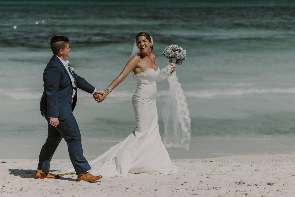 Bride and bride beach portraits at Grand Palladium Riviera Maya LGBT Wedding in Mexico. Caro Navarro Photography