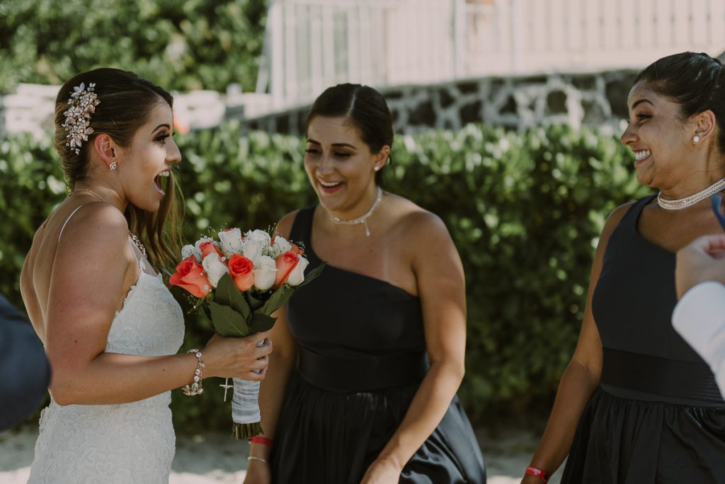 Bride and bridesmaids at Riu Caribe Cancun beach wedding by Caro Navarro Photography