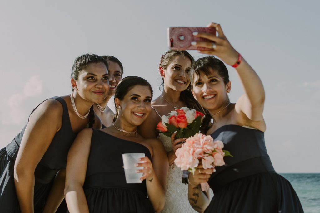Bridal party selfie at Riu Caribe Cancun beach destination wedding by Caro Navarro Photography