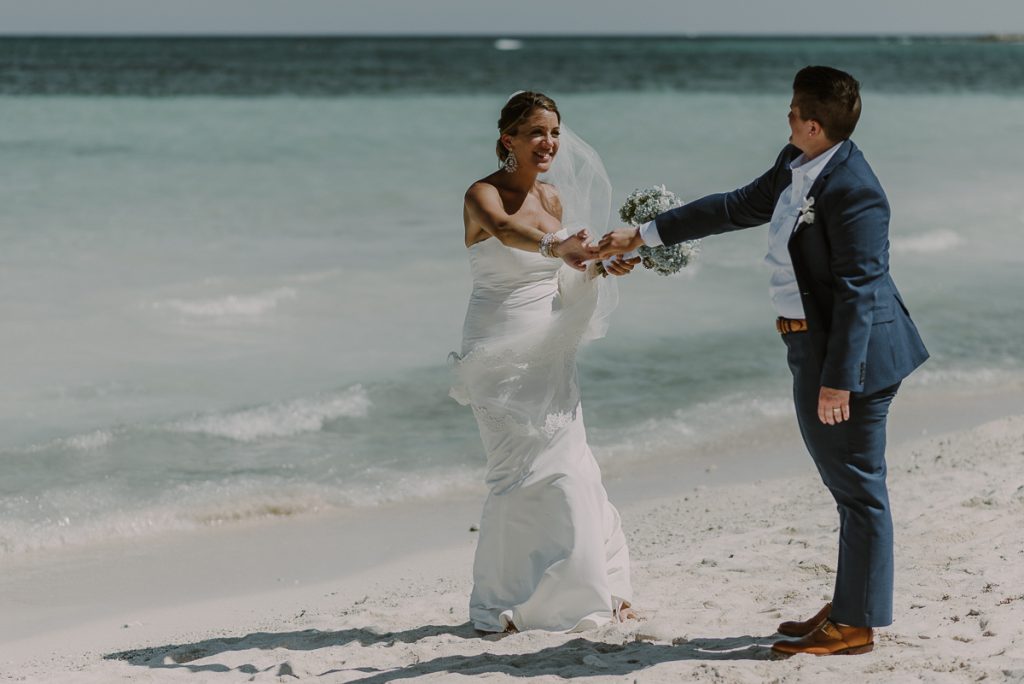 Bride and bride beach portraits at Grand Palladium Riviera Maya LGBT Wedding in Mexico. Caro Navarro Photography