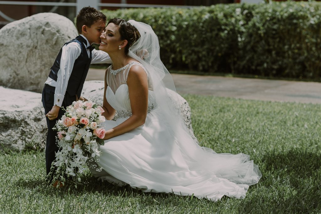 Bride and son garden portraits at Glam Hard Rock Riviera Maya Destination Wedding. Caro Navarro Photography