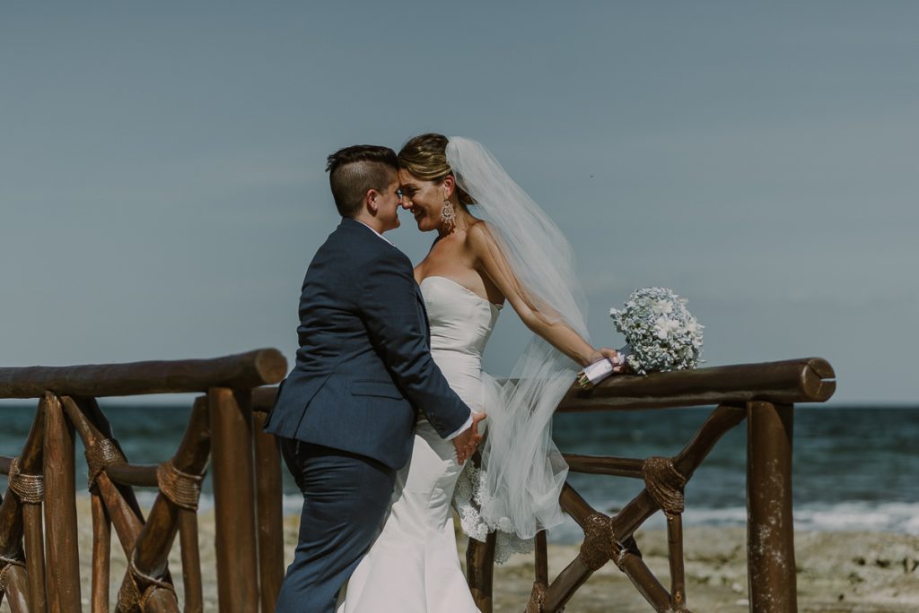 Bride and bride beach portraits at Grand Palladium Riviera Maya LGBT Wedding in Mexico. Caro Navarro Photography