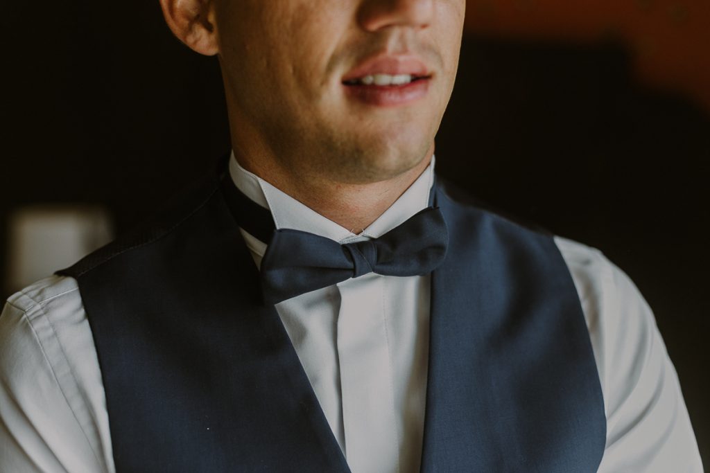 Groom with bow tie and best. Glam Hard Rock Riviera Maya Wedding by Caro Navarro Photography