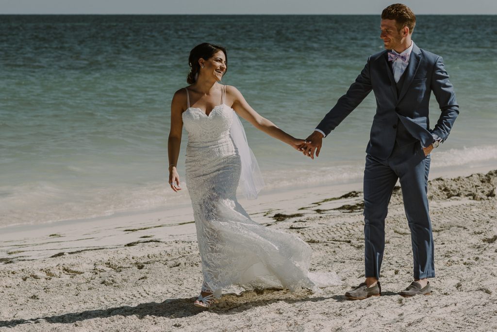 Beach bride and groom portraits by Caro Navarro Photography at Royalton Riviera Cancun