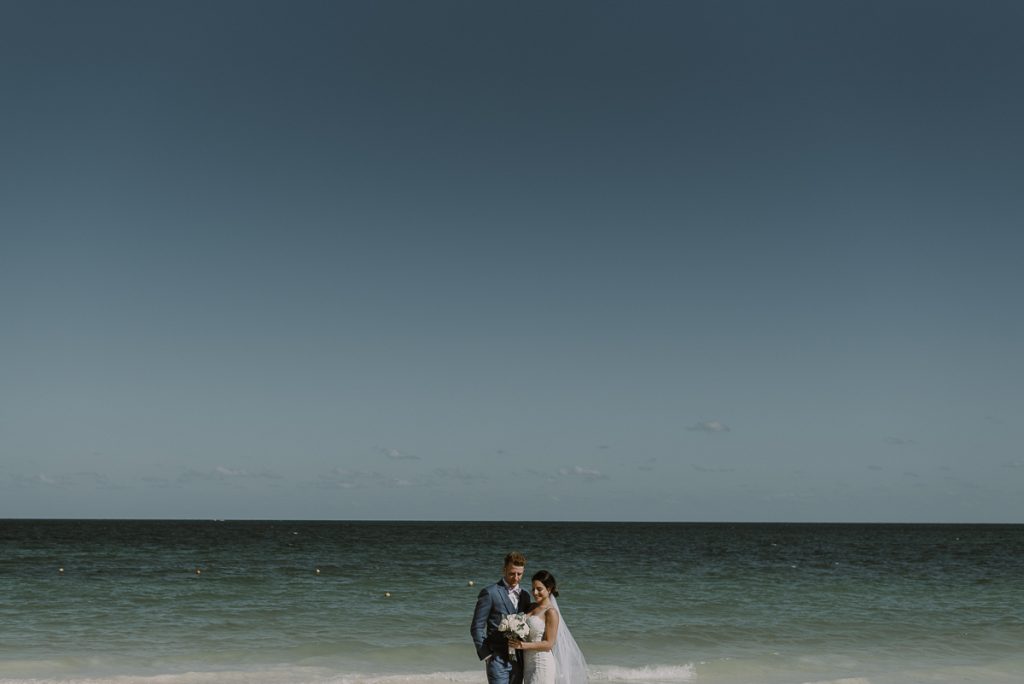 Bride and groom beach portraits. Royalton Riviera Cancun Wedding by Caro Navarro Photography