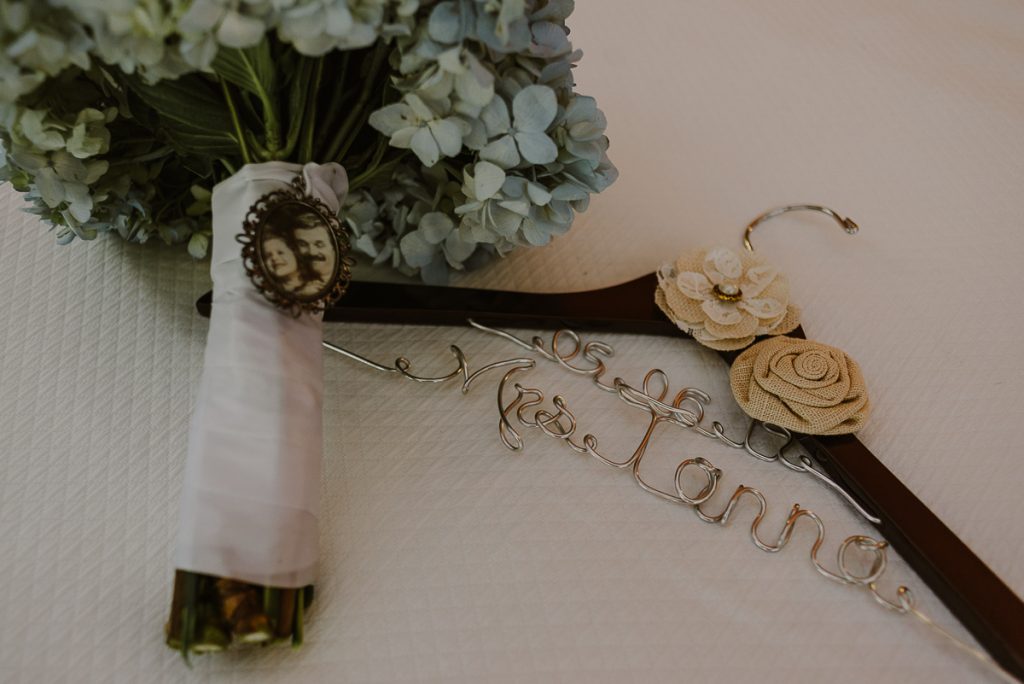Wedding bouquet with photo charm at Grand Palladium Riviera Maya LGBT Wedding in Mexico. Caro Navarro Photography