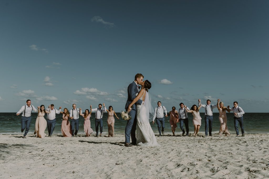 Newlyweds and bridal party beach portraits. Royalton Riviera Cancun Wedding by Caro Navarro Photography
